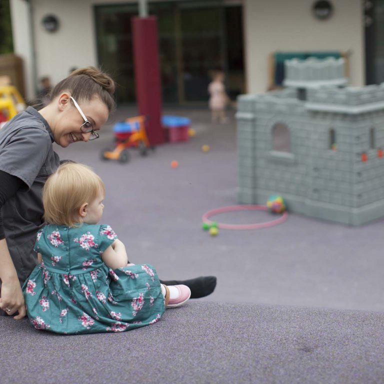 toddler sitting on the floor