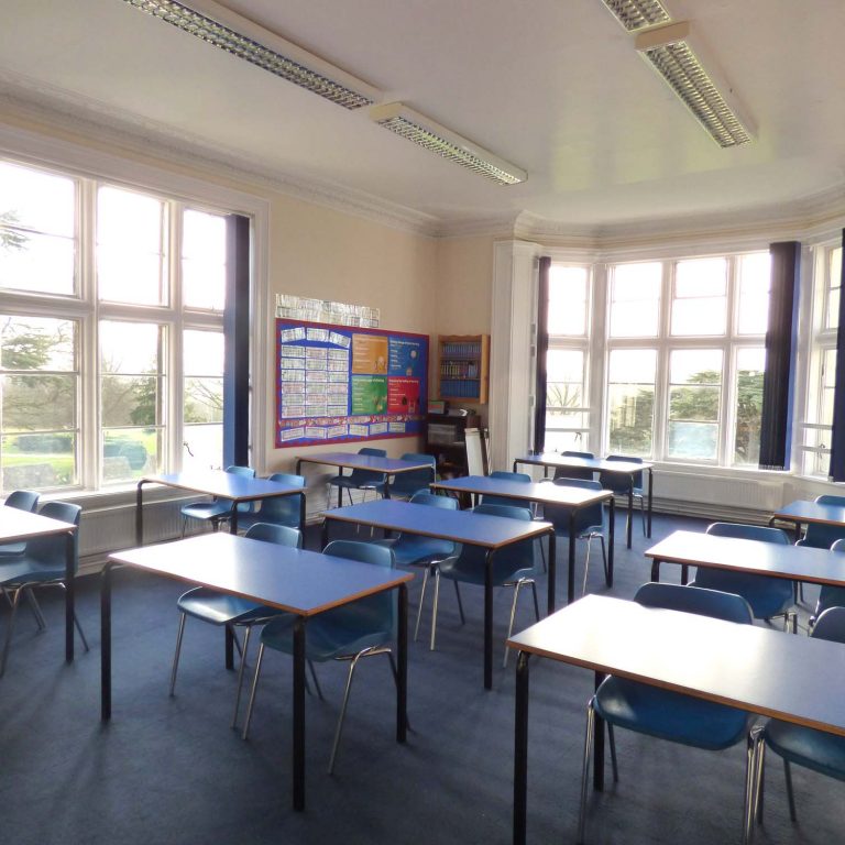 inside of a classroom with tables